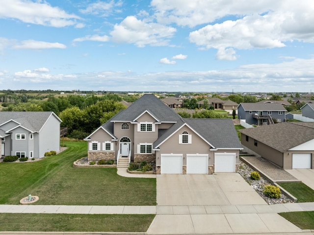 view of front of house with a garage and a front yard