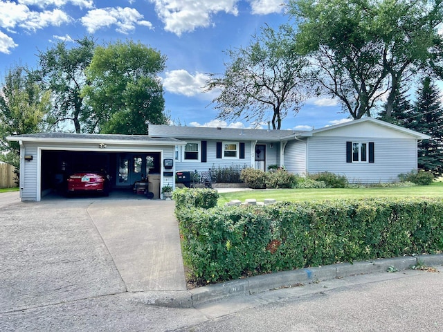 single story home featuring a garage