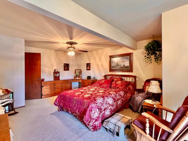 bedroom featuring ceiling fan and carpet