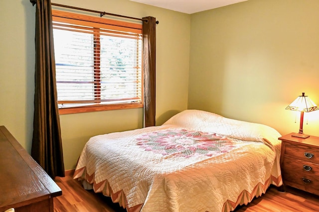 bedroom with wood finished floors