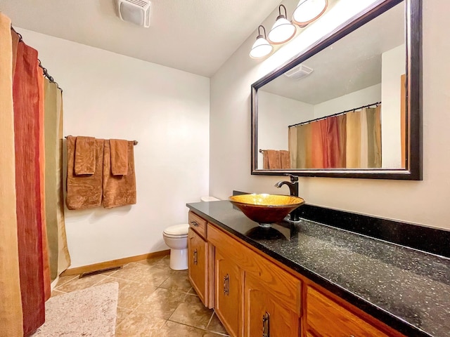 full bath featuring visible vents, toilet, and vanity