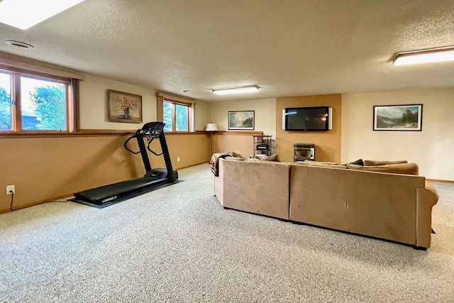 living room with carpet flooring and a textured ceiling