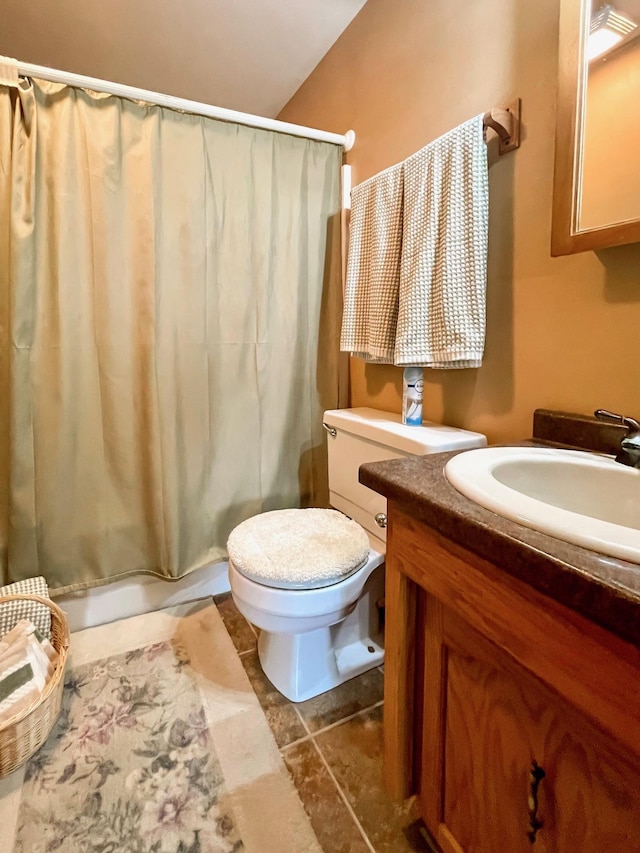 full bathroom featuring toilet, vanity, and shower / bath combination with curtain