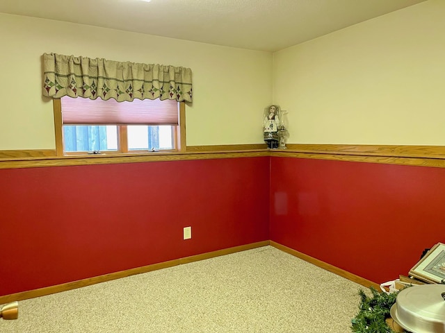 empty room with baseboards