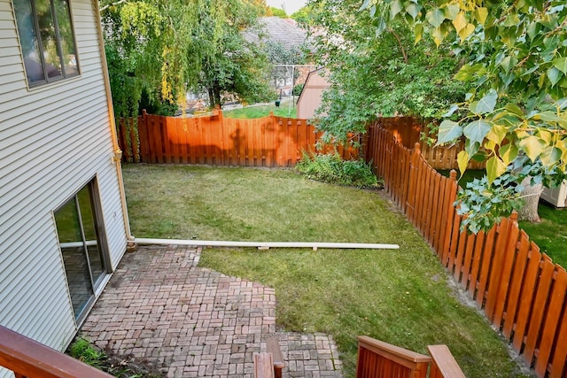 view of yard with a patio and a fenced backyard