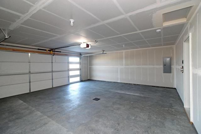 garage featuring a garage door opener and electric panel