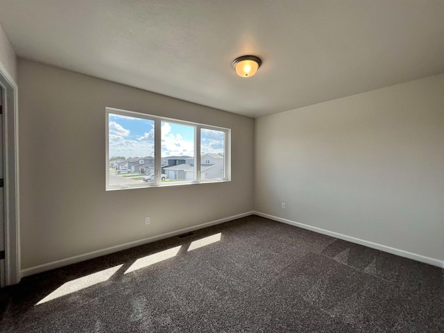 unfurnished room with carpet flooring