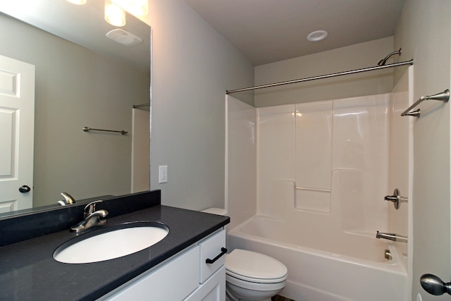 full bathroom with washtub / shower combination, toilet, and vanity