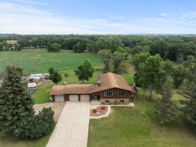 birds eye view of property with a rural view