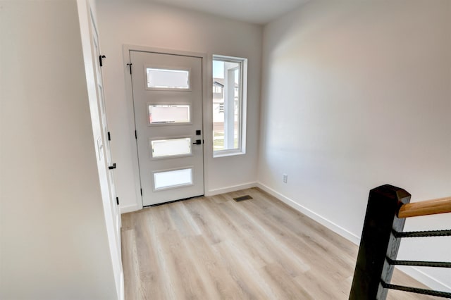 foyer with light hardwood / wood-style floors