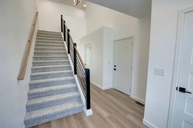 staircase featuring wood-type flooring