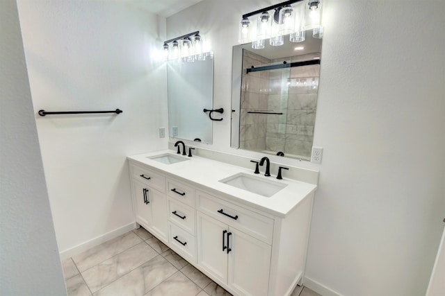 bathroom featuring tile patterned floors, a shower with shower door, and vanity