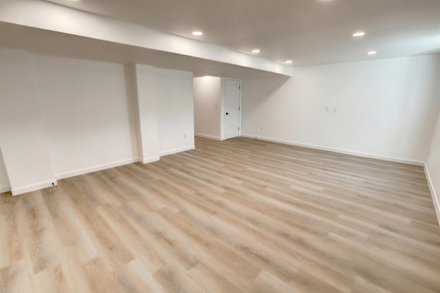 basement featuring light hardwood / wood-style flooring