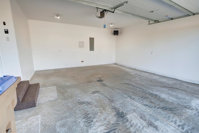 garage featuring a garage door opener and electric panel