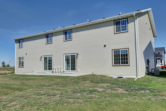 rear view of property with a patio area, a yard, and cooling unit