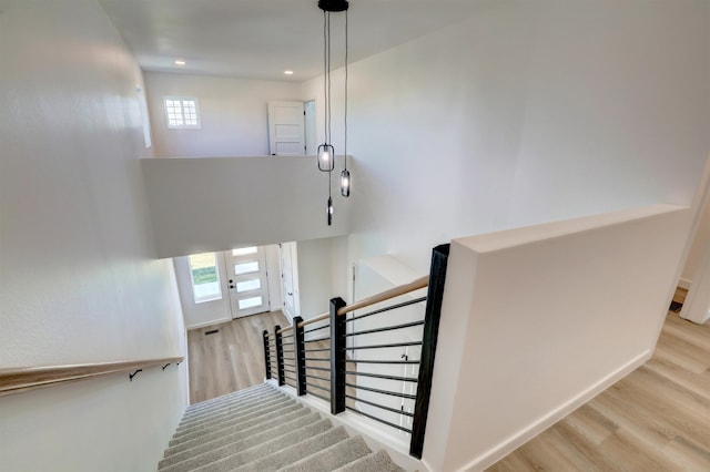 stairway featuring hardwood / wood-style flooring