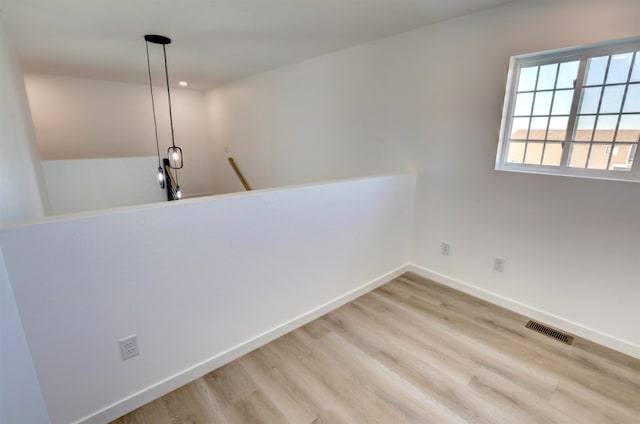 corridor featuring light hardwood / wood-style flooring