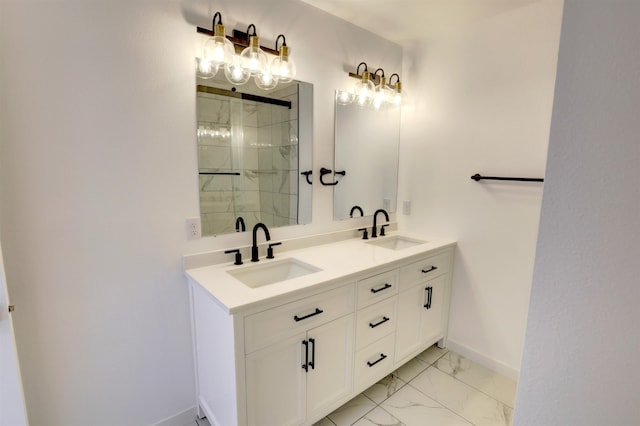 bathroom with a tile shower and vanity