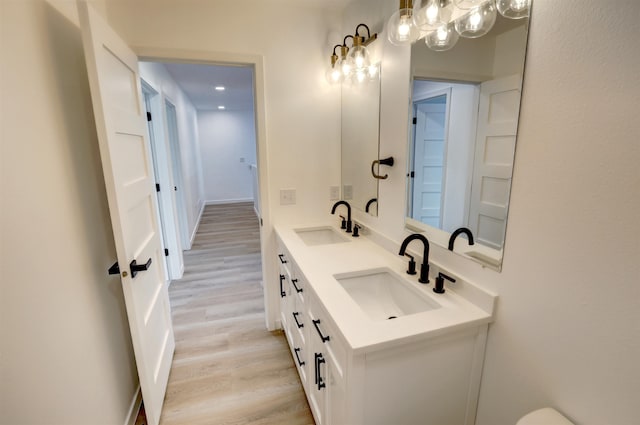 bathroom featuring vanity and wood-type flooring