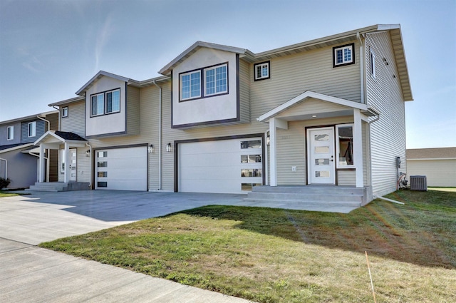 view of property with central AC, a front yard, and a garage