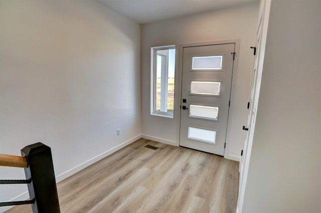 foyer entrance with light wood-type flooring