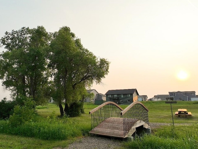 surrounding community featuring a yard