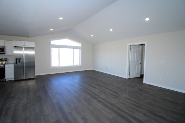 unfurnished living room with dark hardwood / wood-style flooring and vaulted ceiling