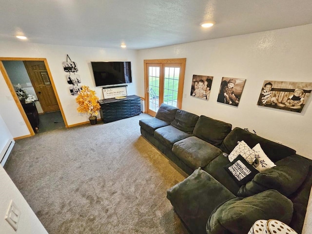 carpeted living room featuring a baseboard heating unit, french doors, and a textured ceiling