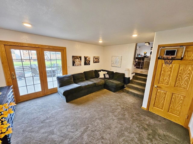 carpeted living room with a textured ceiling