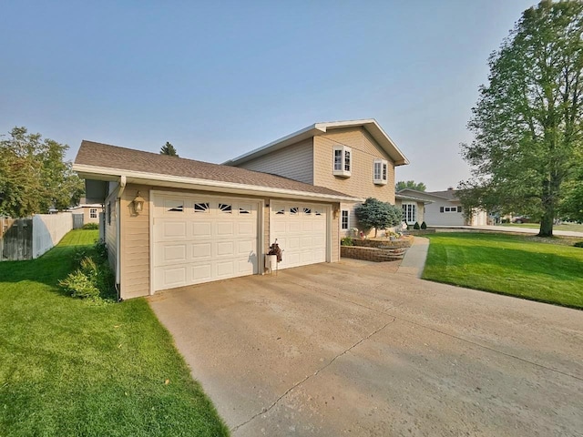 view of front of property featuring a front lawn and a garage