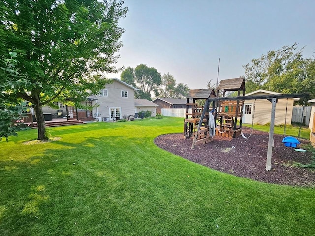 view of yard with a playground and a deck