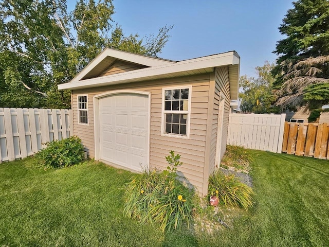 garage featuring a yard