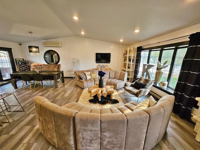 living room featuring lofted ceiling, a wall mounted air conditioner, and light hardwood / wood-style flooring