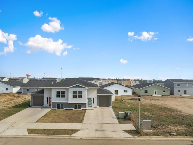 view of front of home featuring a garage, a front lawn, and central AC