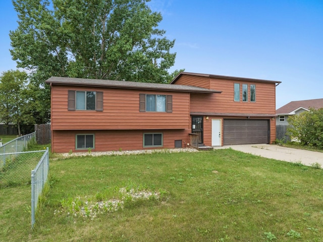 view of front of home featuring a garage and a front yard