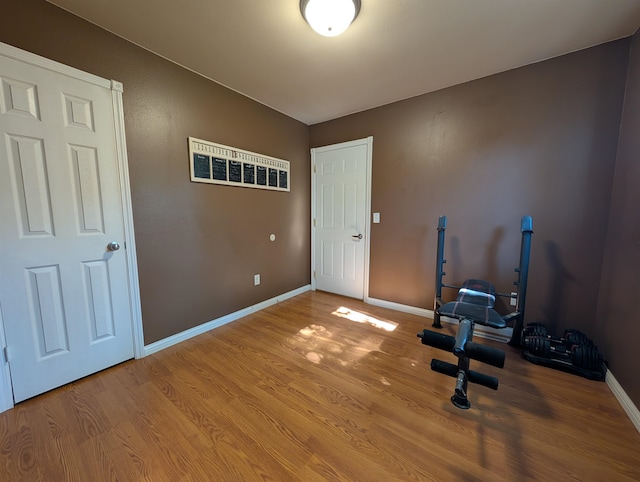 exercise area with wood-type flooring