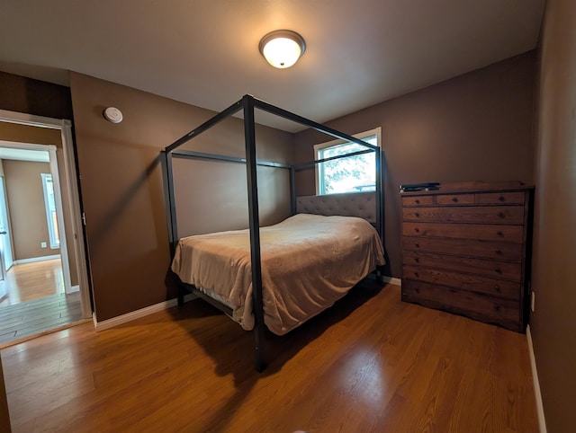 bedroom with wood-type flooring