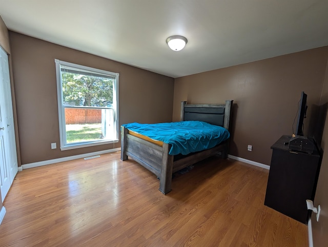 bedroom with light hardwood / wood-style flooring