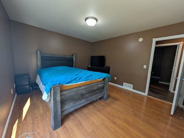 bedroom featuring wood-type flooring