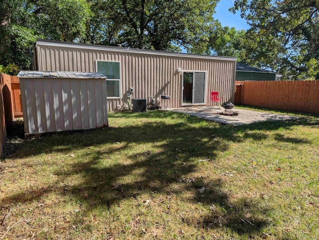 exterior space featuring a patio, a storage unit, and central air condition unit