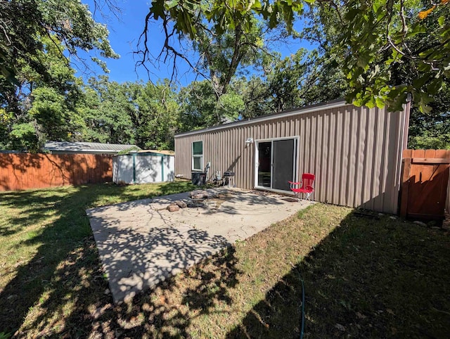 view of yard featuring a patio and a shed