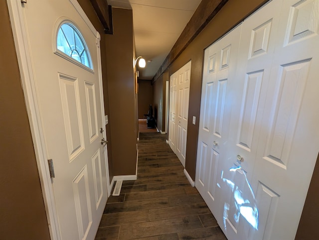 hall with dark wood-type flooring