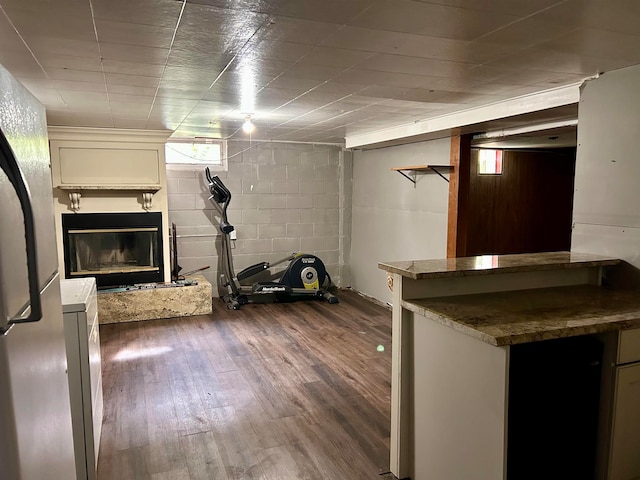 kitchen featuring stone countertops and dark wood-type flooring