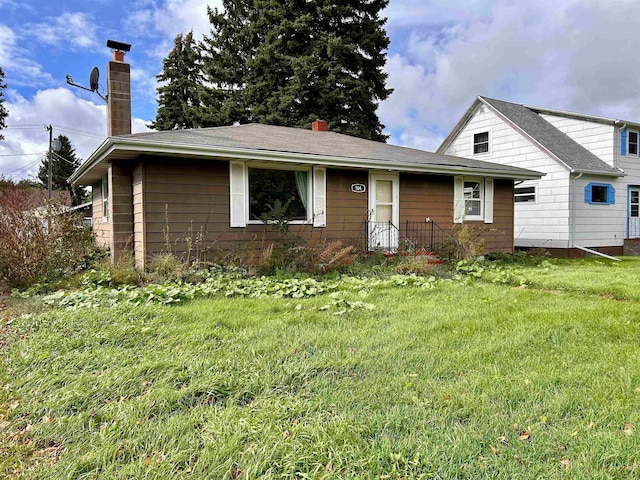 view of front of home with a front yard