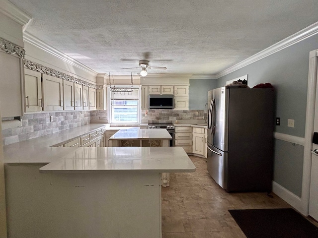 kitchen featuring a kitchen island, backsplash, appliances with stainless steel finishes, ornamental molding, and ceiling fan