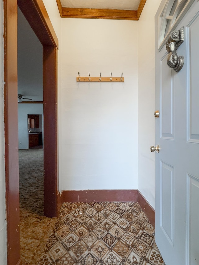 hallway featuring crown molding