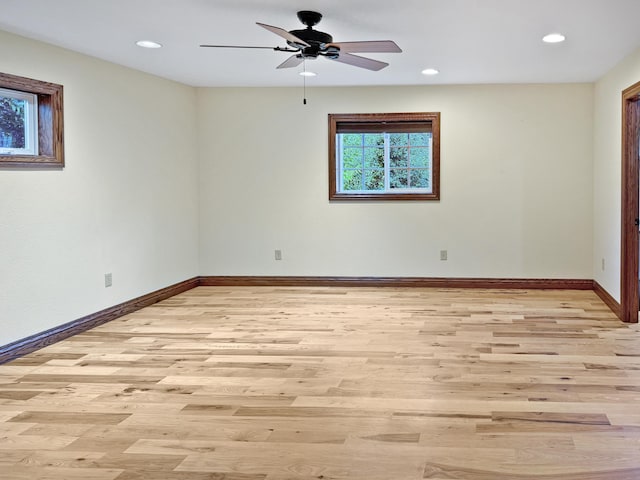 unfurnished room featuring light wood-type flooring and ceiling fan