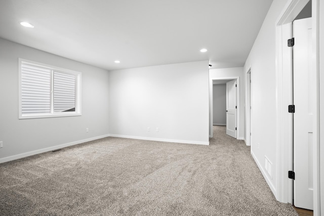 spare room featuring carpet floors