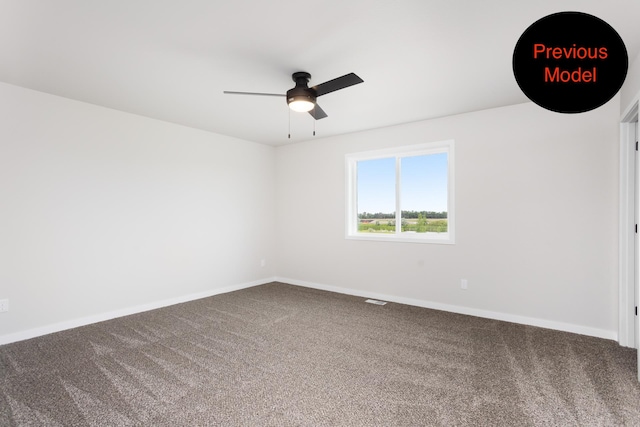 carpeted spare room with ceiling fan