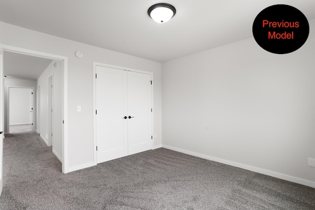 unfurnished bedroom with carpet floors and a closet